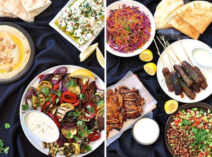 餐桌上摆满了阿拉伯盛宴/中东菜单上的菜肴，菜品包括鸡肉沙瓦玛，羊肉饼，鹰嘴豆泥，鹰嘴豆沙拉。